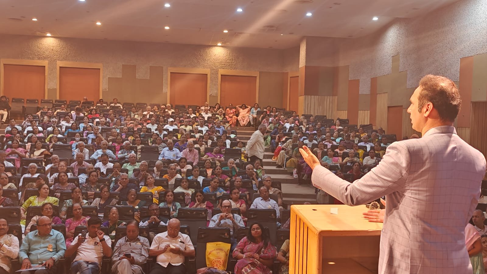 Dr. Bhagyesh Kulkarni addressing participants at a health camp